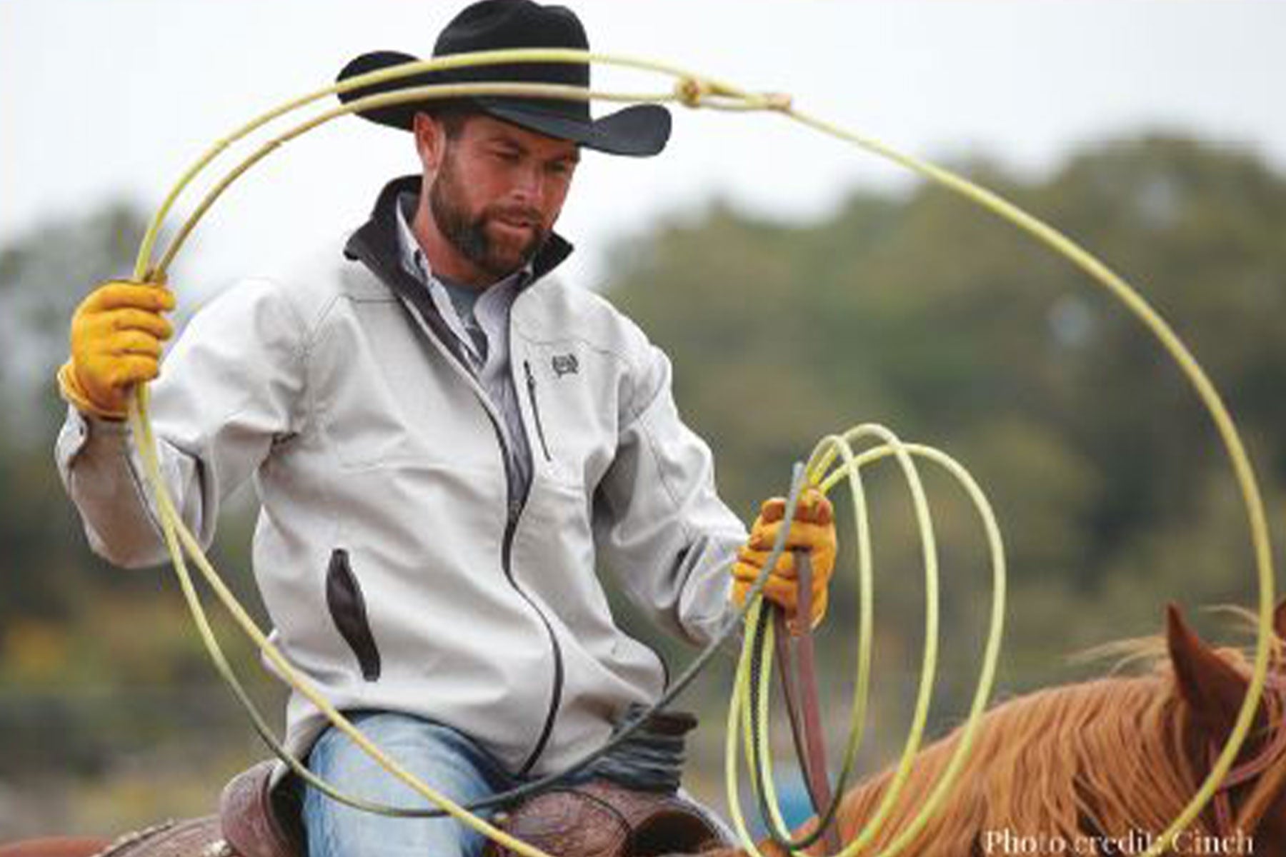 Paul Eaves on horseback with a rope