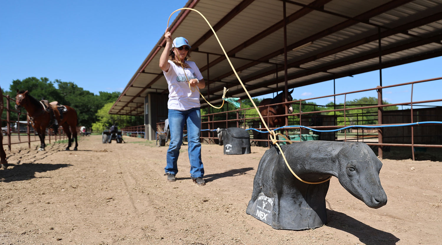 woman roping a heel o matic nex roping dummy